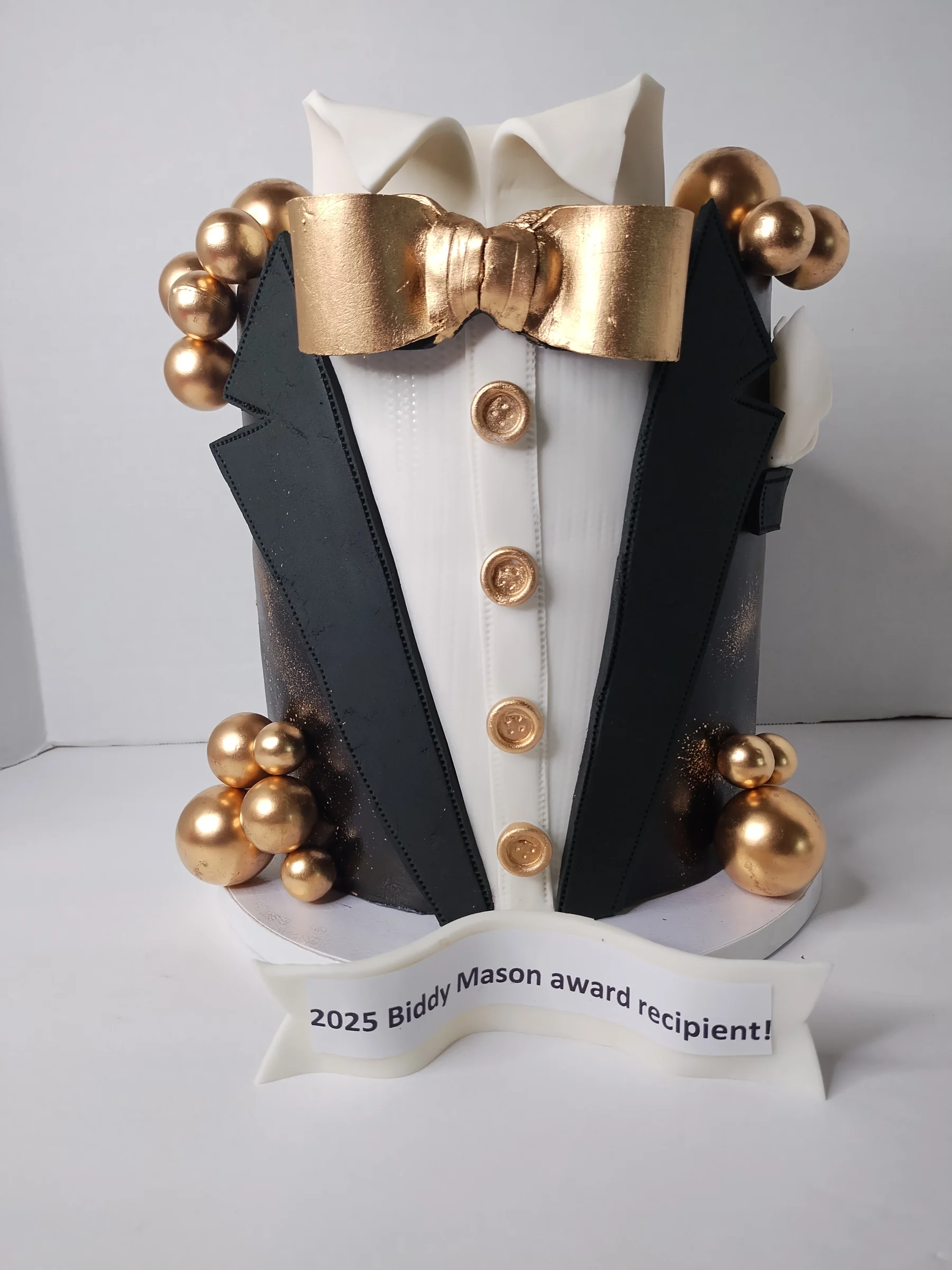Tuxedo-themed sculpted cake